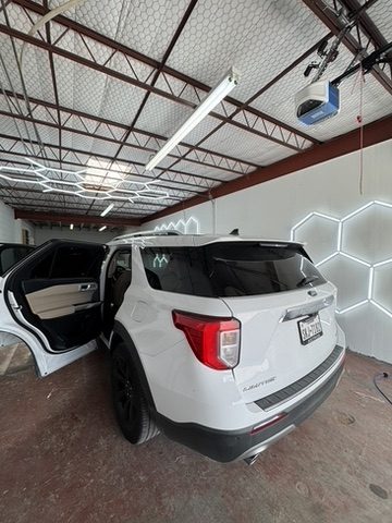 White Ford Explorer SUV with window tint in Houston, TX