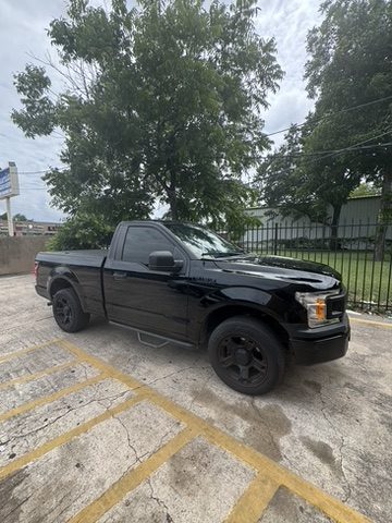Black Ford F-150 truck with window tint in Houston, TX